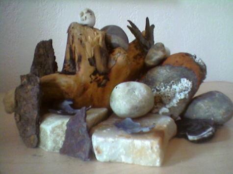 Seattle rocks, seaweed, driftwood, shells, rusty Underground iron, and a chunk of barnacled & eroded brick with mortar.